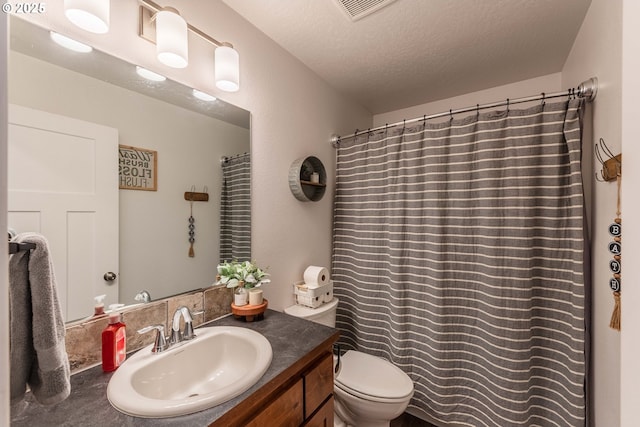 bathroom with vanity, curtained shower, a textured ceiling, toilet, and visible vents