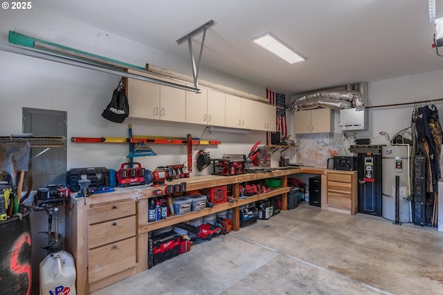 garage with water heater and a workshop area
