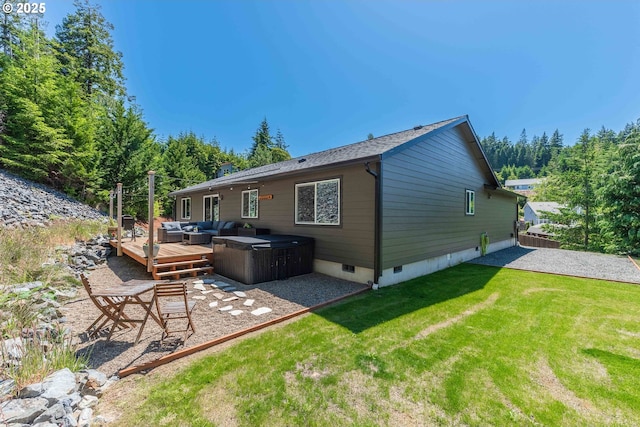 rear view of property featuring a yard, a patio area, crawl space, an outdoor living space, and a wooden deck
