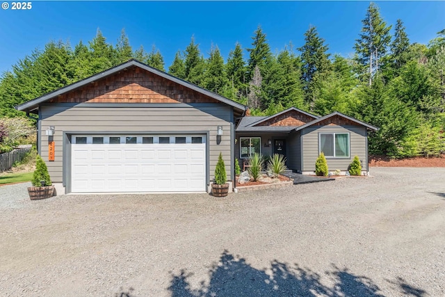 single story home with a garage and dirt driveway