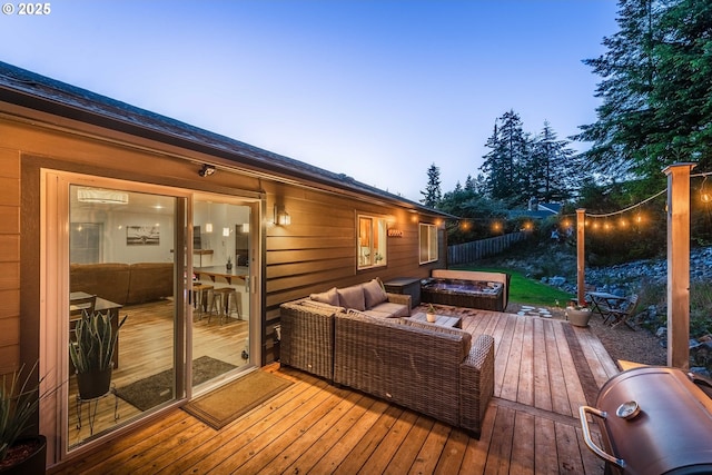 deck with grilling area, fence, and an outdoor hangout area