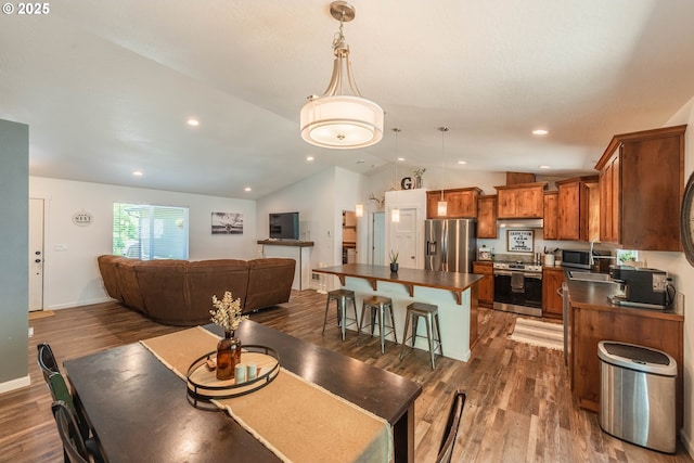 dining room featuring baseboards, dark wood-style floors, recessed lighting, and lofted ceiling