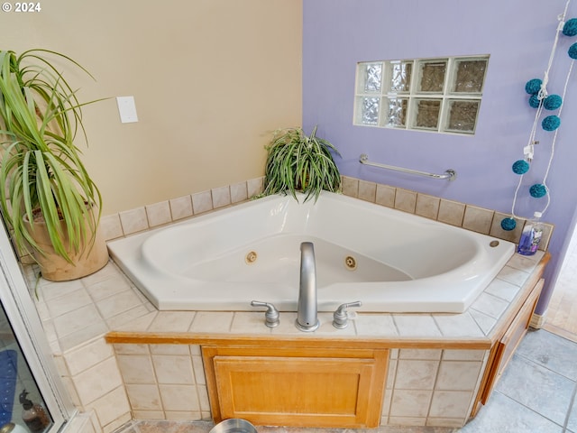 bathroom with a tub with jets