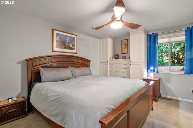 178 SW The Pines Dr, Depoe Bay, OR 97341 - bedroom featuring light carpet, baseboards, and a ceiling fan