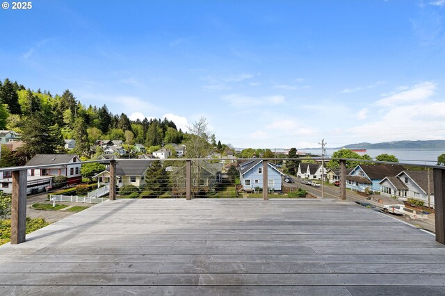 wooden deck featuring a residential view