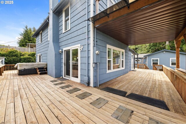 deck featuring a hot tub