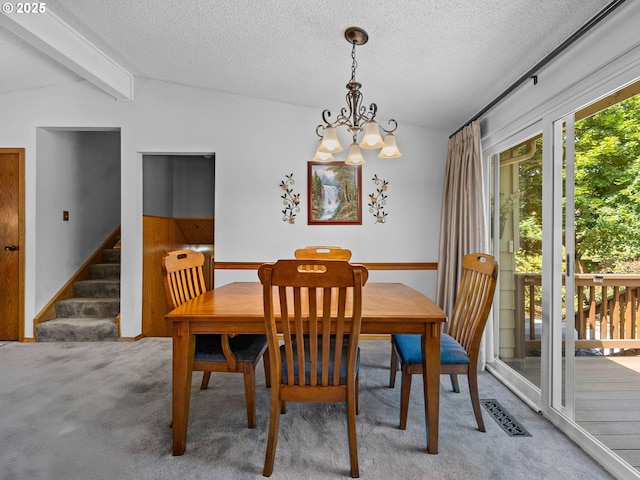 19085 SW Jaylee St, Beaverton, OR 97078 - dining space featuring carpet, a textured ceiling, a chandelier, and stairs