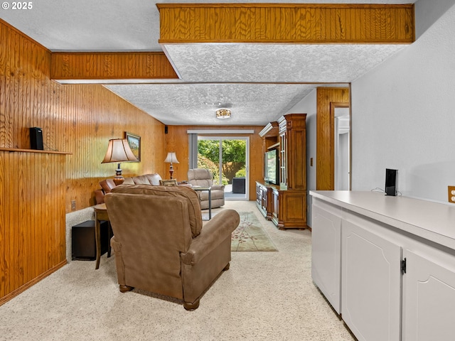 19085 SW Jaylee St, Beaverton, OR 97078 - living room featuring a textured ceiling, wooden walls, a desk, and light carpet