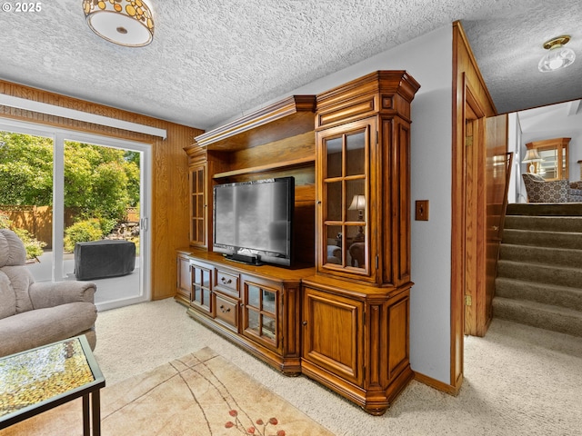 19085 SW Jaylee St, Beaverton, OR 97078 - living area featuring light carpet, stairway, and a textured ceiling
