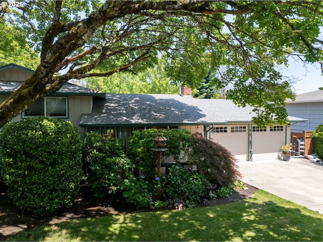 19085 SW Jaylee St, Beaverton, OR 97078 - view of front of house featuring driveway, a chimney, an attached garage, and roof with shingles