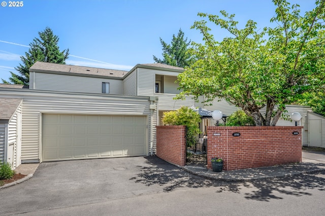 16760 SW Monaco Ln, Portland, OR 97224 - view of front of home featuring asphalt driveway and a garage