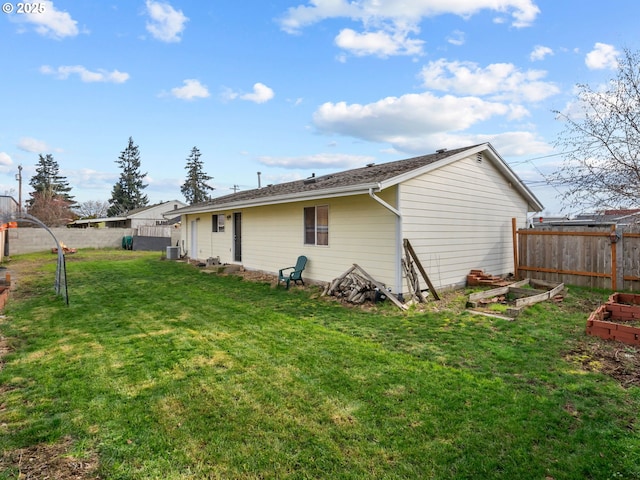 back of property featuring a lawn