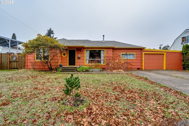 single story home with a garage, fence, and driveway