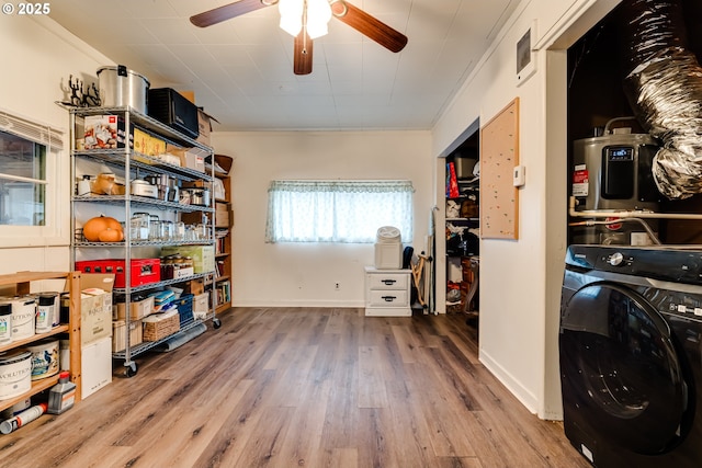 laundry area with ceiling fan, laundry area, washer / clothes dryer, visible vents, and wood finished floors
