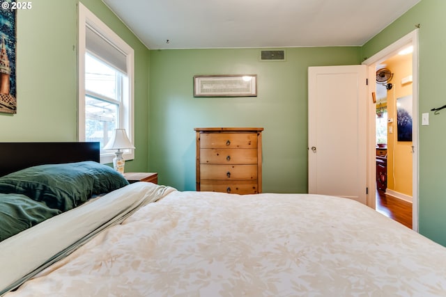bedroom featuring visible vents