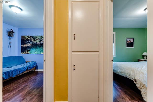 bedroom with dark wood-type flooring