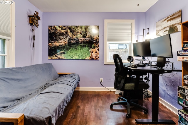 office space with baseboards and wood finished floors