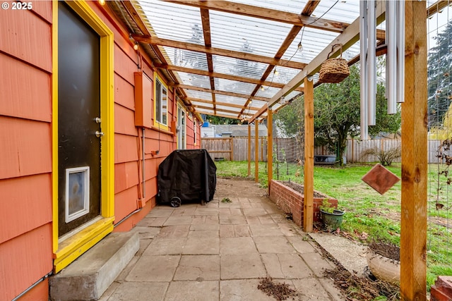 view of patio with a pergola, a fenced backyard, and a grill