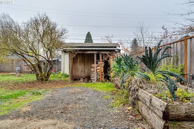 view of outbuilding featuring a fenced backyard and an outbuilding