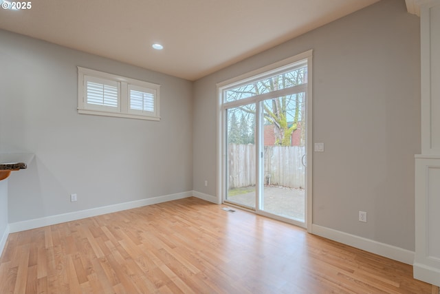 unfurnished room with light hardwood / wood-style flooring