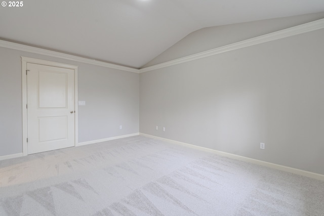 carpeted spare room with lofted ceiling