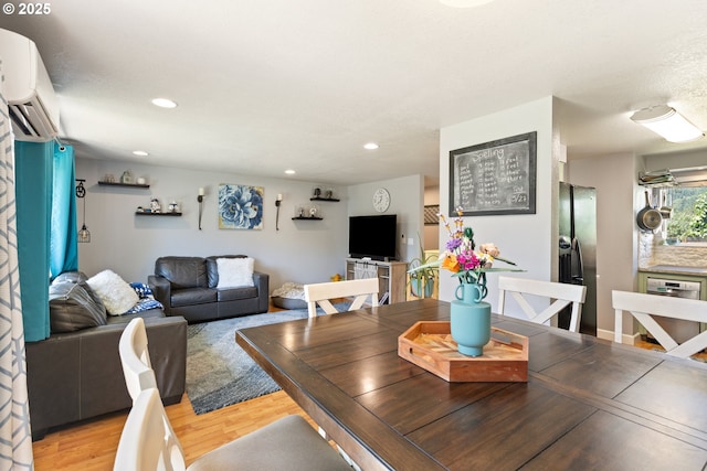 1448 S Grove Lane Ct, Sutherlin, OR 97479 - dining area featuring a wall mounted air conditioner, light wood finished floors, and recessed lighting