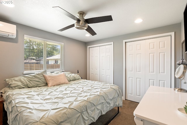 1448 S Grove Lane Ct, Sutherlin, OR 97479 - bedroom with two closets, dark carpet, a wall unit AC, recessed lighting, and a ceiling fan