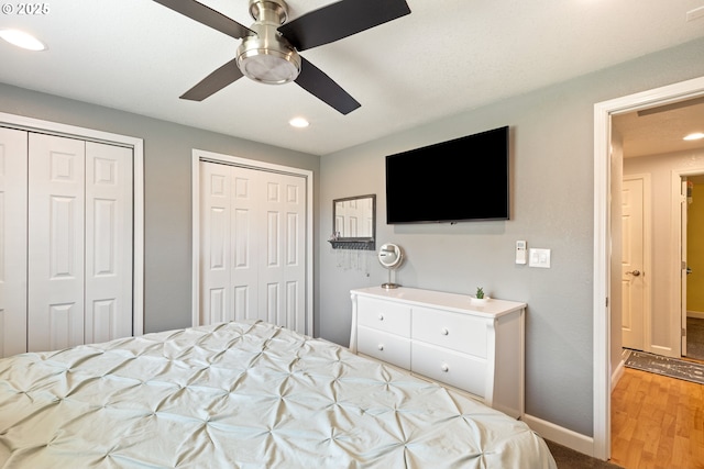 1448 S Grove Lane Ct, Sutherlin, OR 97479 - bedroom with multiple closets, baseboards, recessed lighting, wood finished floors, and ceiling fan