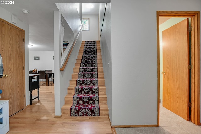 staircase with wood finished floors