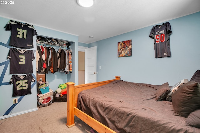 bedroom featuring carpet flooring, a closet, and baseboards