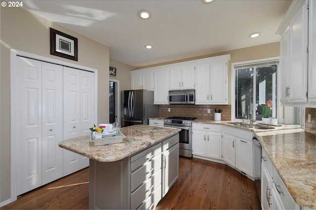 4506 Black Forest Ct, Lake Oswego, OR 97035 - kitchen with stainless steel appliances, white cabinets, decorative backsplash, and recessed lighting