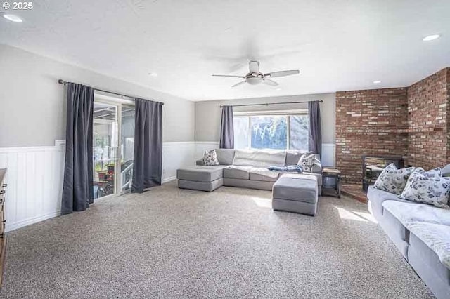 1216 Montgomery Pl NE, Albany, OR 97321 - living room featuring a ceiling fan, a wainscoted wall, and carpet