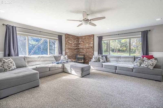 1216 Montgomery Pl NE, Albany, OR 97321 - living room featuring healthy amount of natural light, ceiling fan, carpet floors, and a wainscoted wall