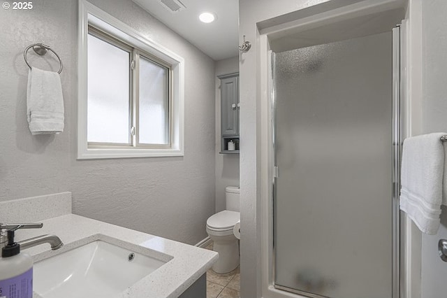 1216 Montgomery Pl NE, Albany, OR 97321 - bathroom featuring a stall shower, toilet, vanity, tile patterned flooring, and a textured wall