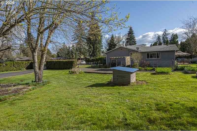 1216 Montgomery Pl NE, Albany, OR 97321 - view of green lawn featuring a garage