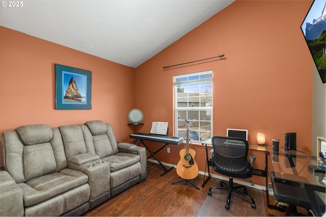 office space with vaulted ceiling, wood finished floors, and baseboards