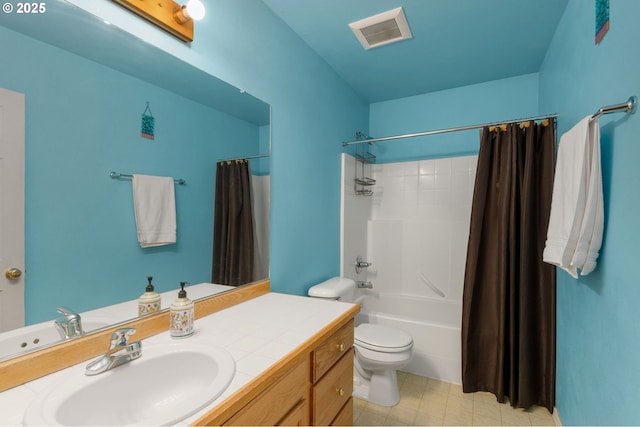 full bath with visible vents, toilet, vanity, and shower / tub combo with curtain