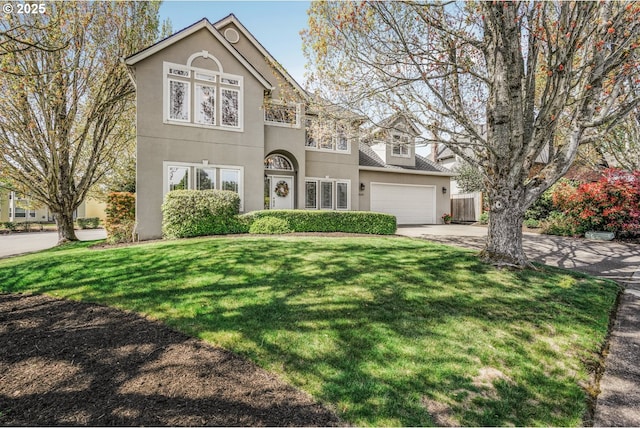 15255 NW Francesca Dr, Portland, OR 97229 - traditional home featuring a garage, stucco siding, concrete driveway, and a front lawn