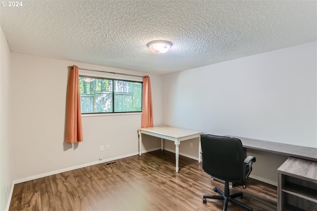 office space with wood-type flooring and a textured ceiling