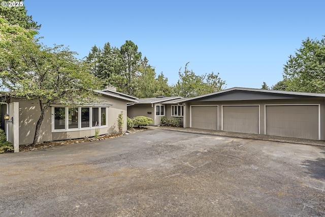 ranch-style home with a garage