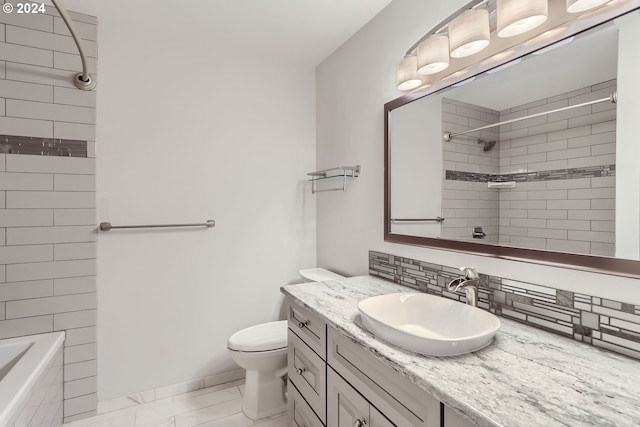 full bathroom with tasteful backsplash, vanity, toilet, and tiled shower / bath combo