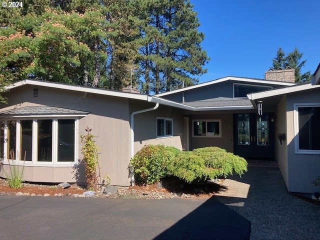 view of side of home featuring french doors