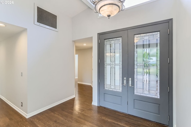 entryway with dark wood-type flooring and french doors