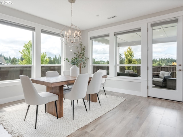 1703 S Farm View Loop, Ridgefield, WA 98642 - dining room with a chandelier and light wood-style flooring