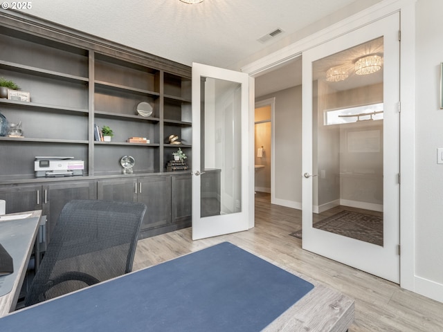 1703 S Farm View Loop, Ridgefield, WA 98642 - unfurnished office with french doors, light wood-style flooring, and baseboards