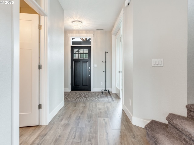 1703 S Farm View Loop, Ridgefield, WA 98642 - entryway featuring wood finished floors, stairway, and baseboards