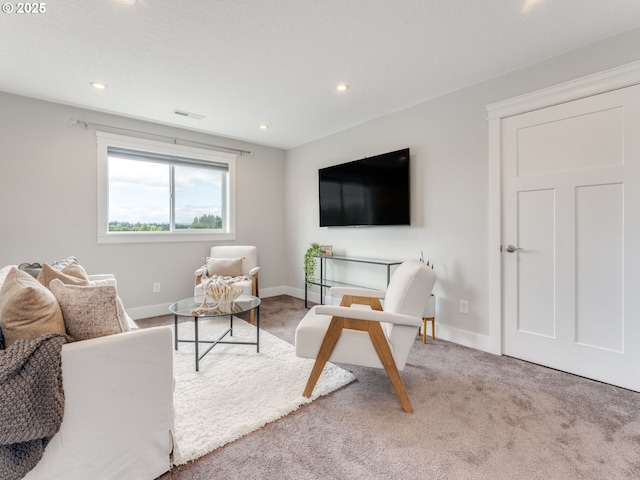 1703 S Farm View Loop, Ridgefield, WA 98642 - living area featuring light carpet, recessed lighting, and baseboards