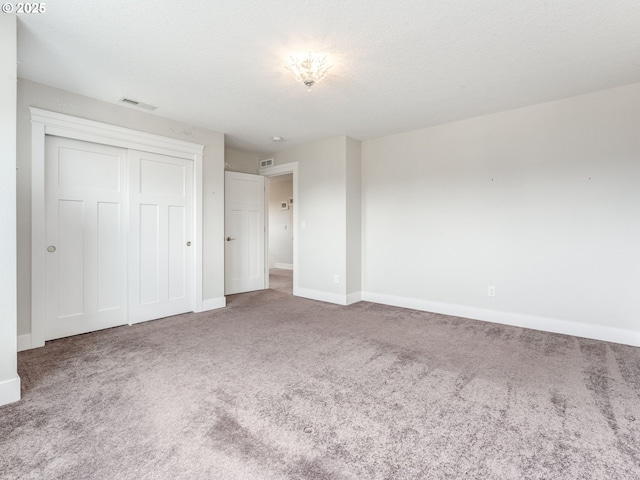 1703 S Farm View Loop, Ridgefield, WA 98642 - unfurnished bedroom with carpet, baseboards, and a closet