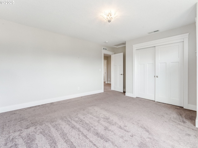 1703 S Farm View Loop, Ridgefield, WA 98642 - unfurnished bedroom featuring carpet floors, baseboards, and a closet