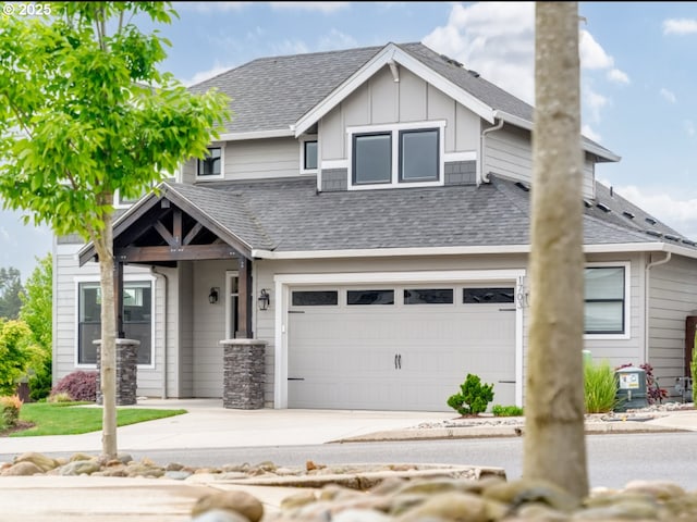 1703 S Farm View Loop, Ridgefield, WA 98642 - view of front of home featuring a garage, concrete driveway, board and batten siding, and roof with shingles
